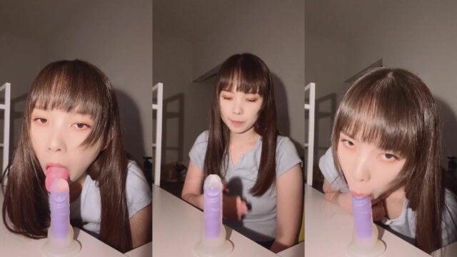 Cute Japanese teen sucking plastic dildo